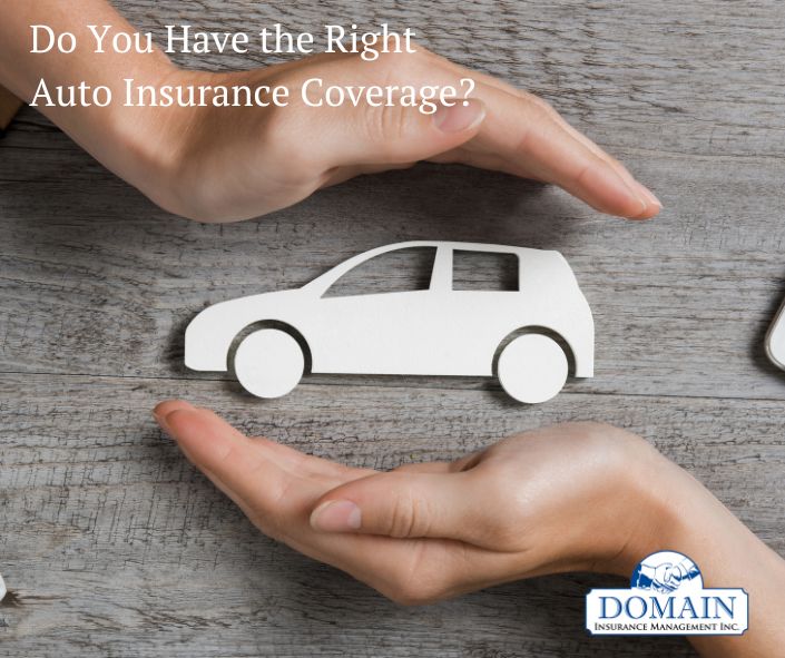 What Does Auto Insurance Really Cover blog photo showing hands around a paper car cutout.