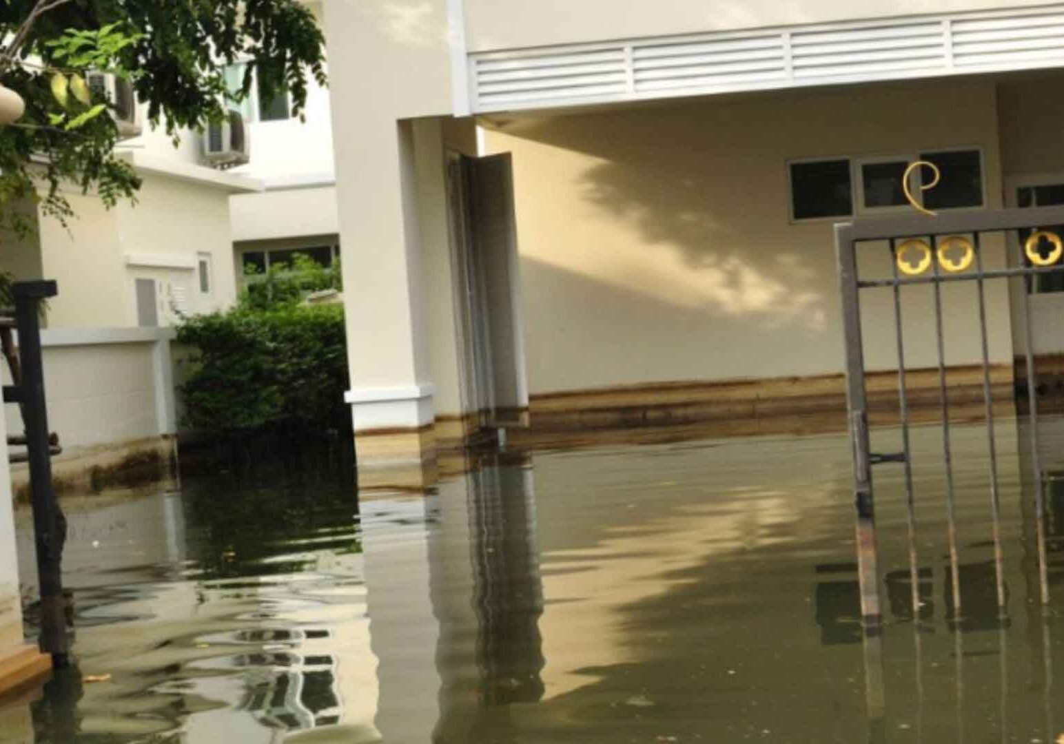 flood4 flooded property with gate broken